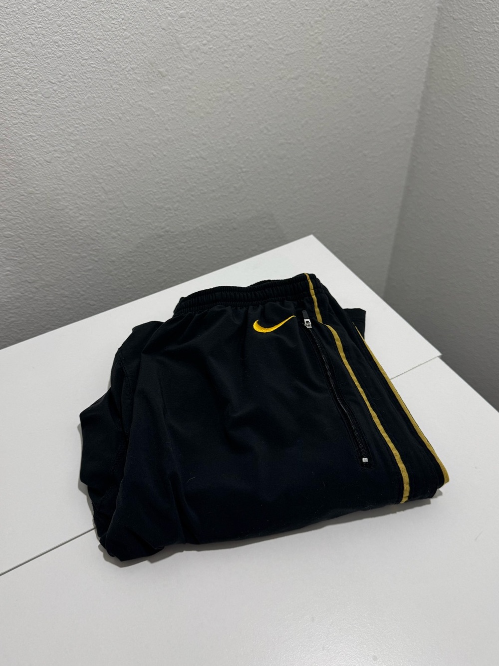 Black and yellow Nike vintage lightweight track pants